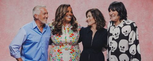 The Bake-off hosts standing next to one another