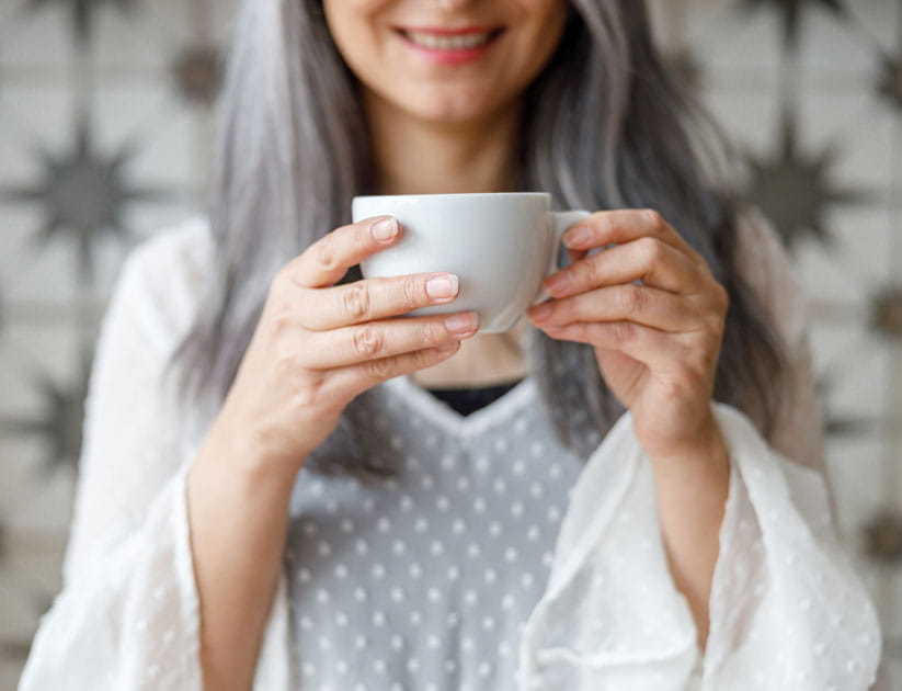 Mature woman holding a tea cup