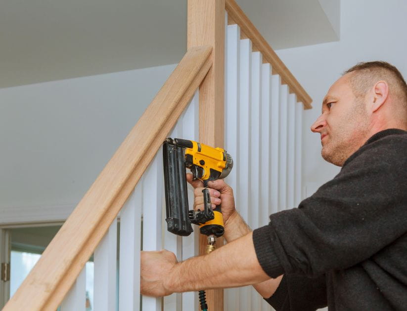 Man putting on handrail