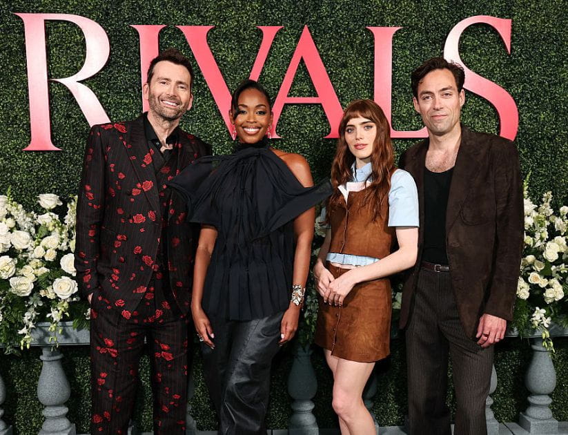 The cast of the Rivals TV series in front of the show's logo at the launch