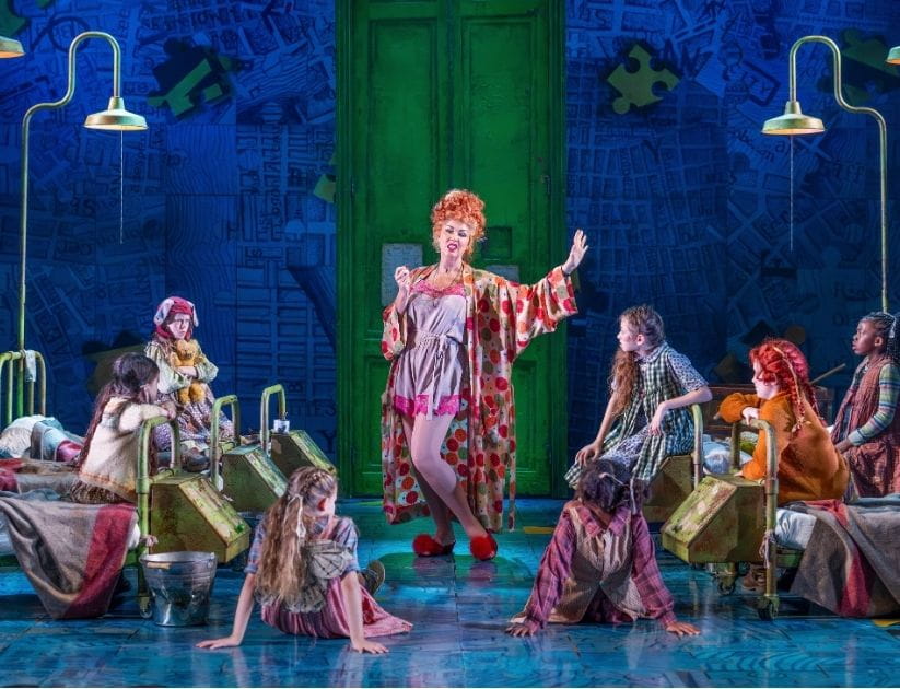 The cast of 'Annie' performing on stage