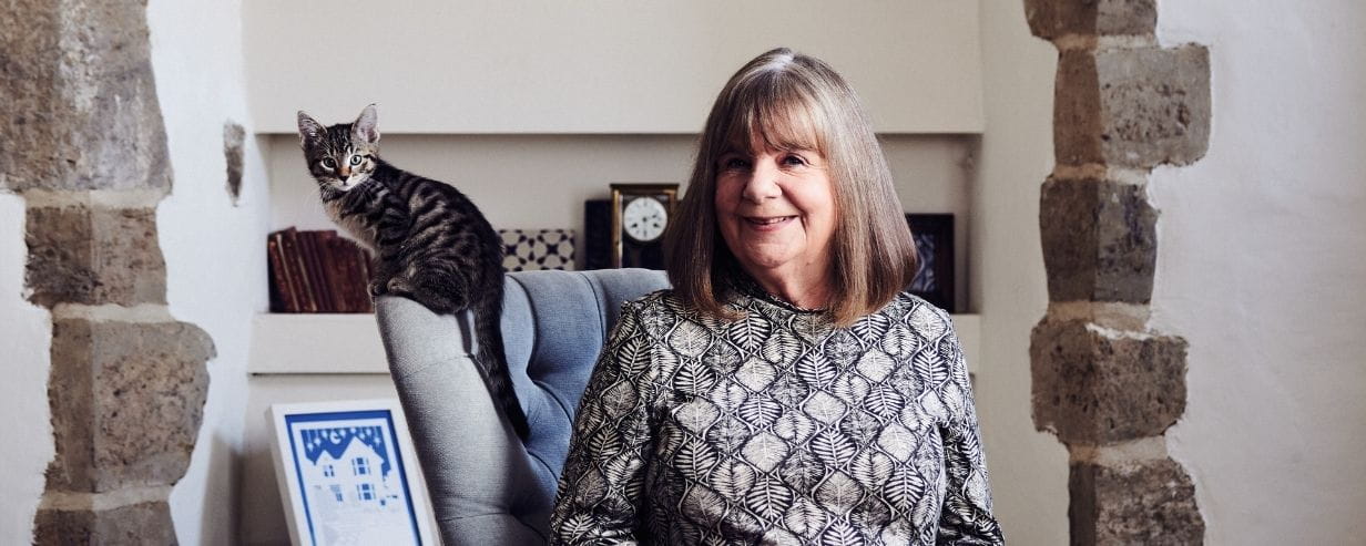 Dame Julia Donaldson sitting next to her cat