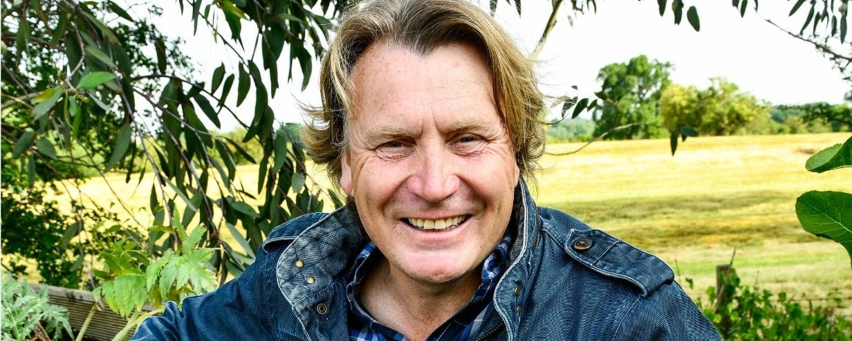 TV gardener David Domoney standing in a field