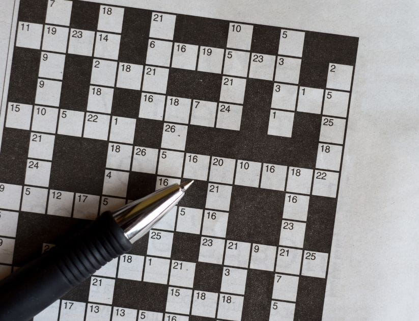 A game of codeword with a pen resting on top