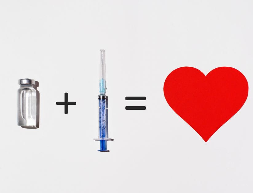 concept of vaccination health benefits showing a vaccine bottle providing heart benefits