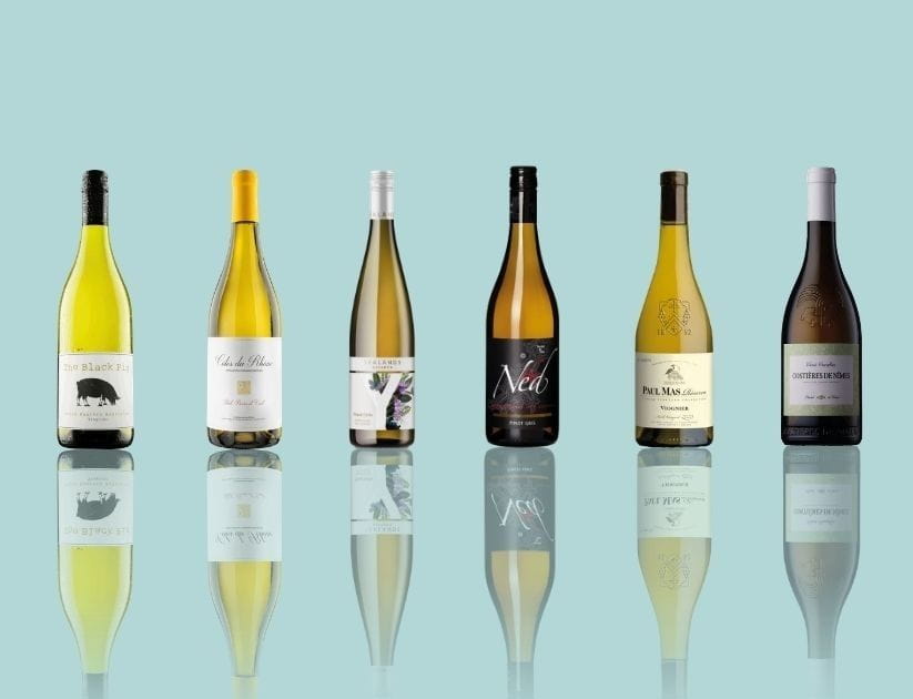 A display of five different bottles of white wine