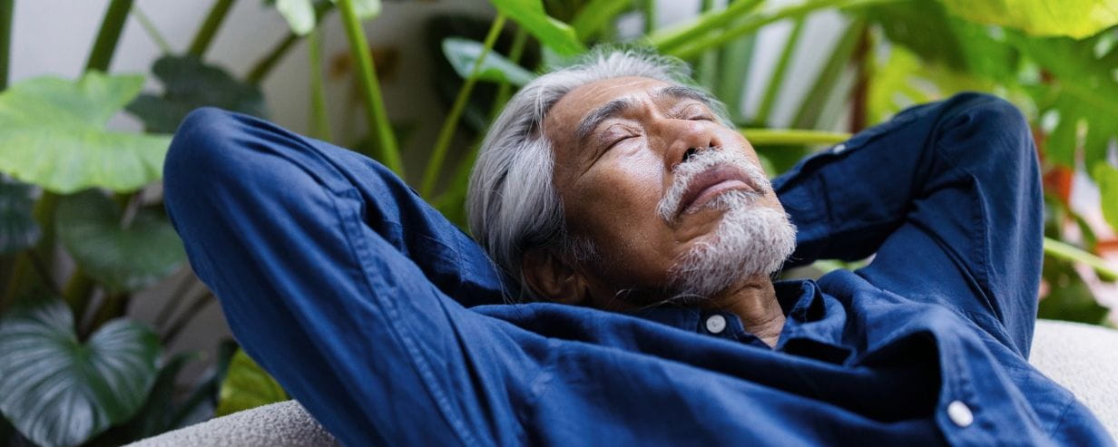 Image of a man relaxing outdoors