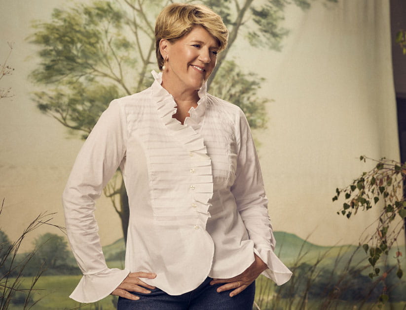 Clare Balding on set with Saga Magazine wearing a white blouse