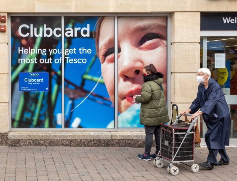 Tesco Club card advertising in the window of a store in Berkshire.