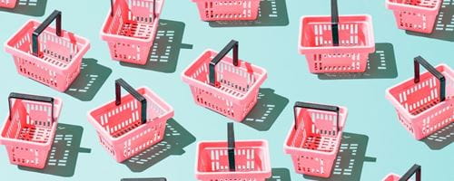 Multiple shopping carts laid in a random pattern on a colorful background.