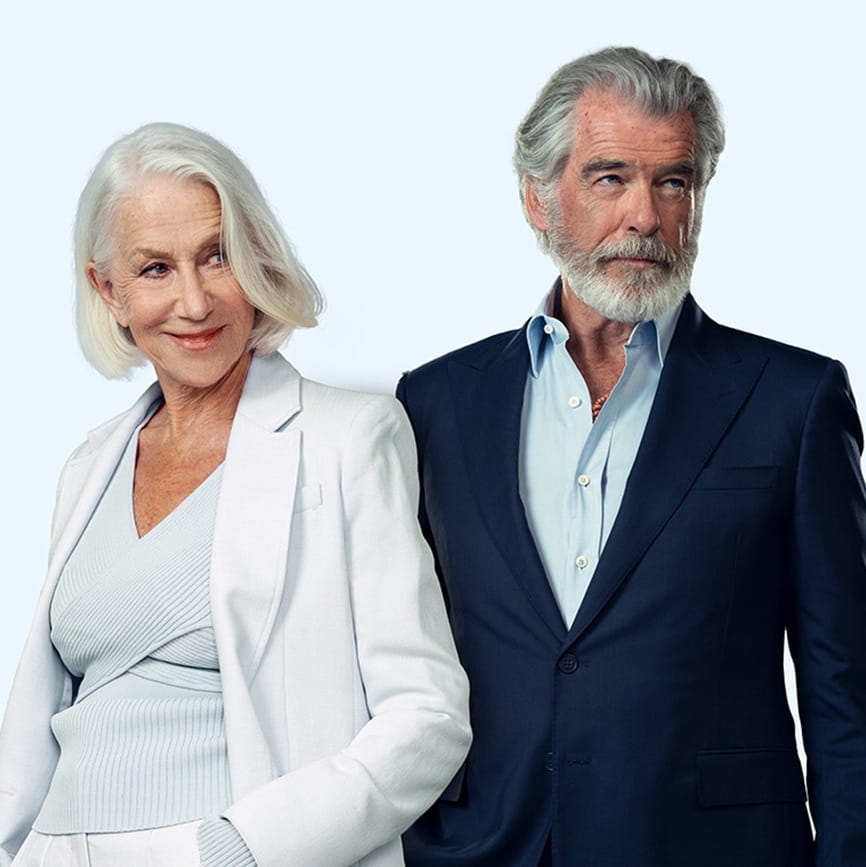 Helen Mirren and Pierce Brosnan standing next to each other facing the camera