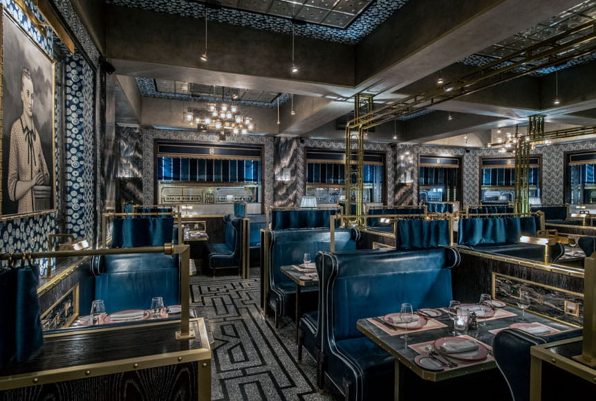 The interior of the Bob Bob Ricard restaurant in Soho luxuriously decorated with blue leather booths and bronze trimming