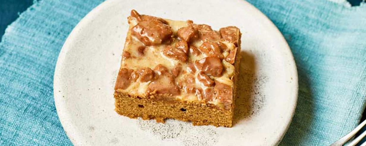 A square of Nadiya Hussain's biscoff tray bake on a plate