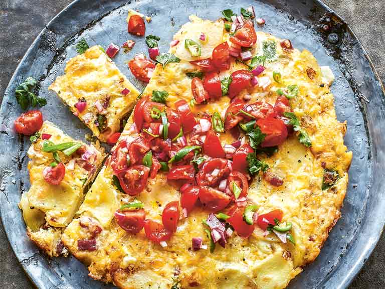 Spanish omelette topped with a fresh salsa