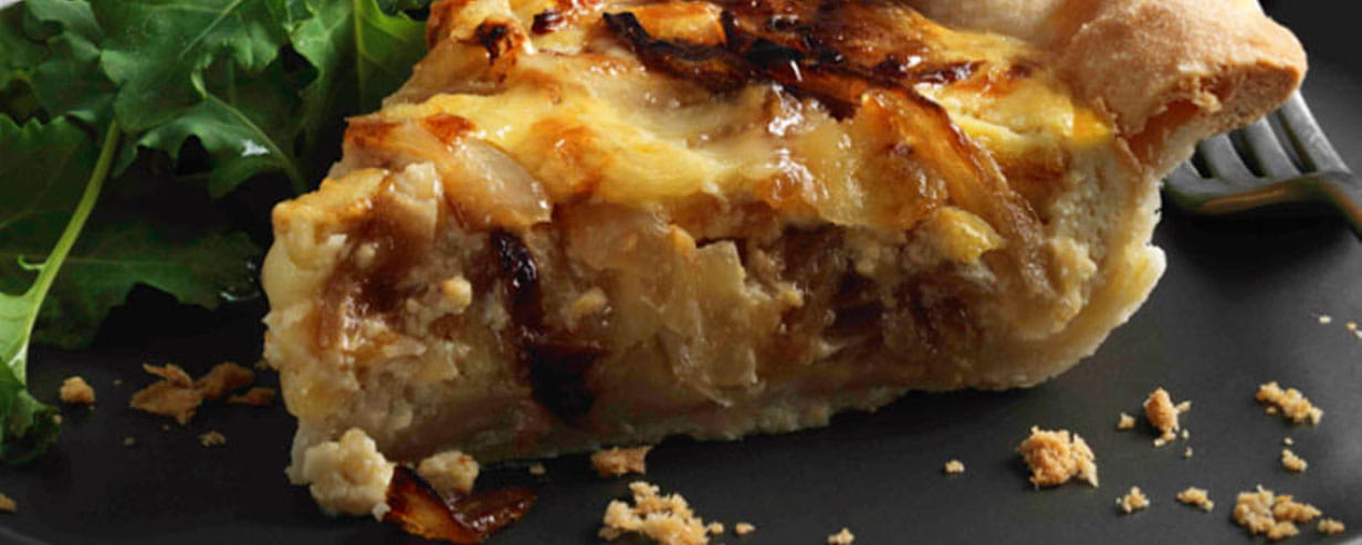 Cheddar cheese and caramelised onion tart