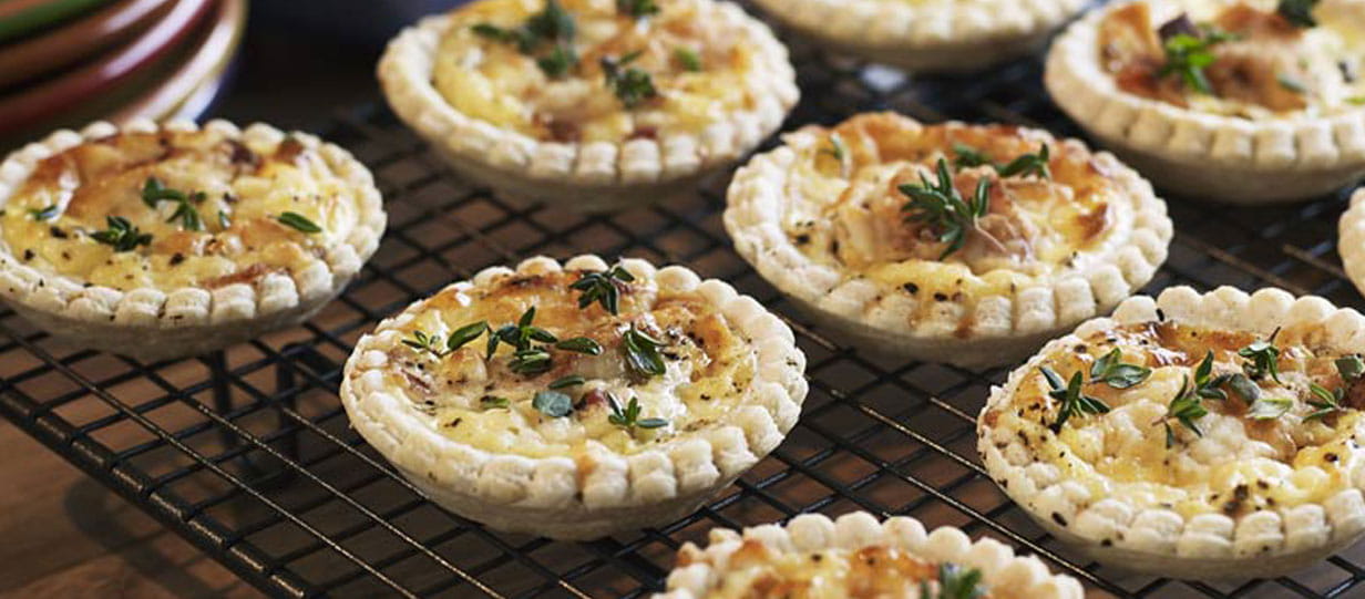 Mini quiches on a baking rack