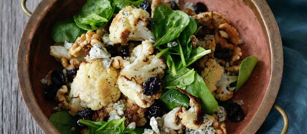 Roast cauliflower, spinach and blue cheese salad with cherries and walnuts