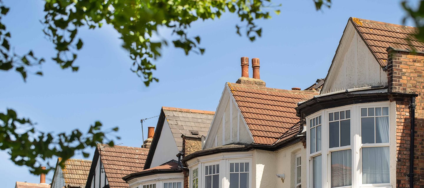 A row of Edwardian houses on a blue sky day