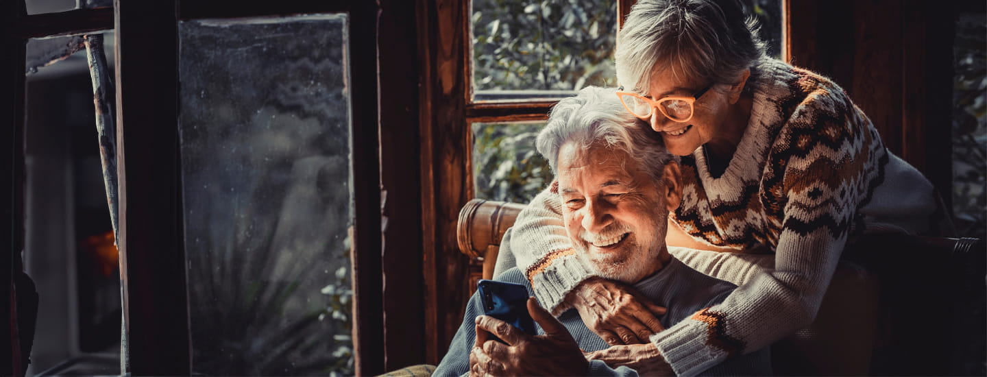 A couple hugging each other at home