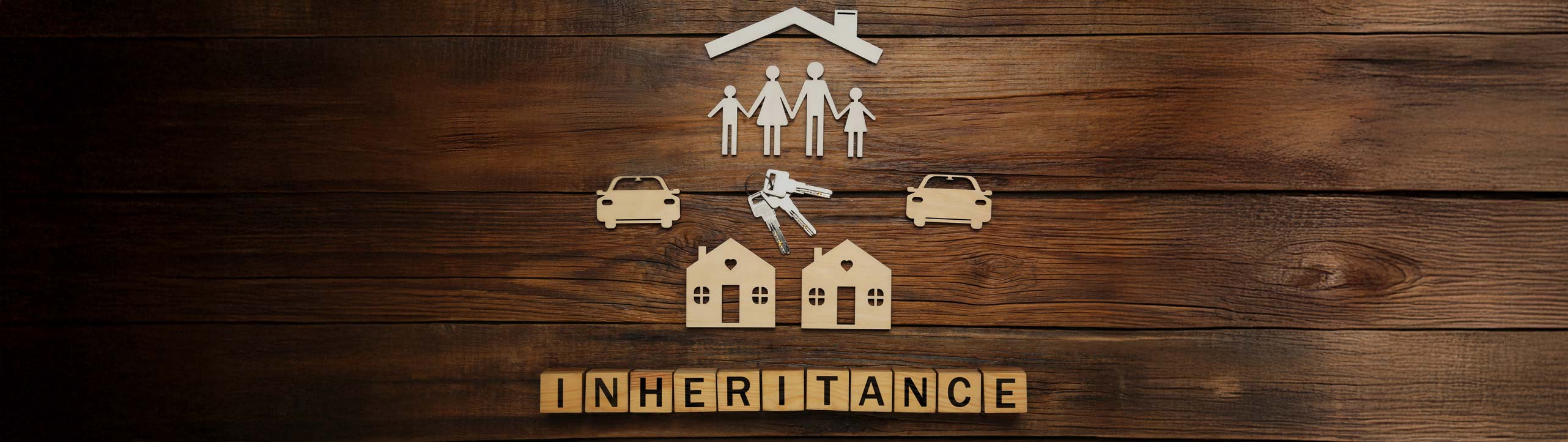 Word Inheritance made with cubes and different cutouts on wooden background, flat lay