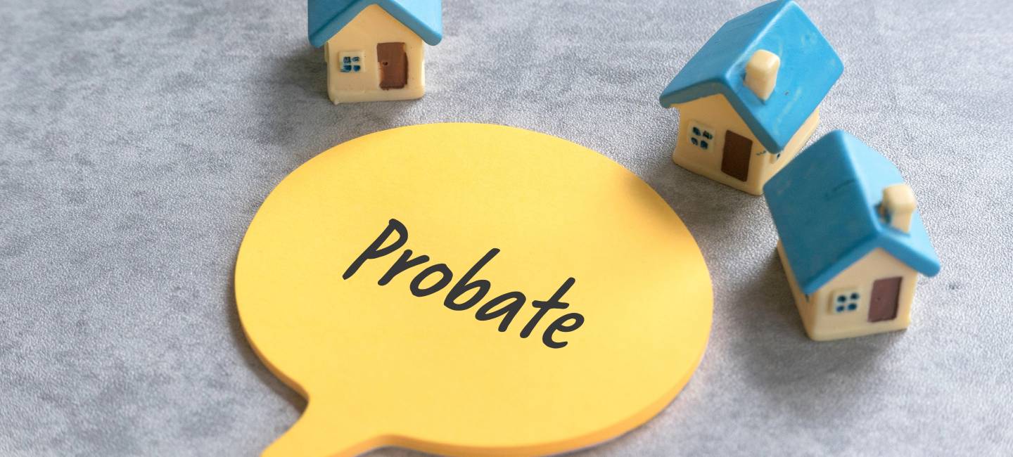 Toy House with a Speech Bubble Displaying the Word 'Probate'