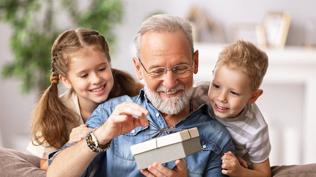 A grandfather with his grandchildren at home