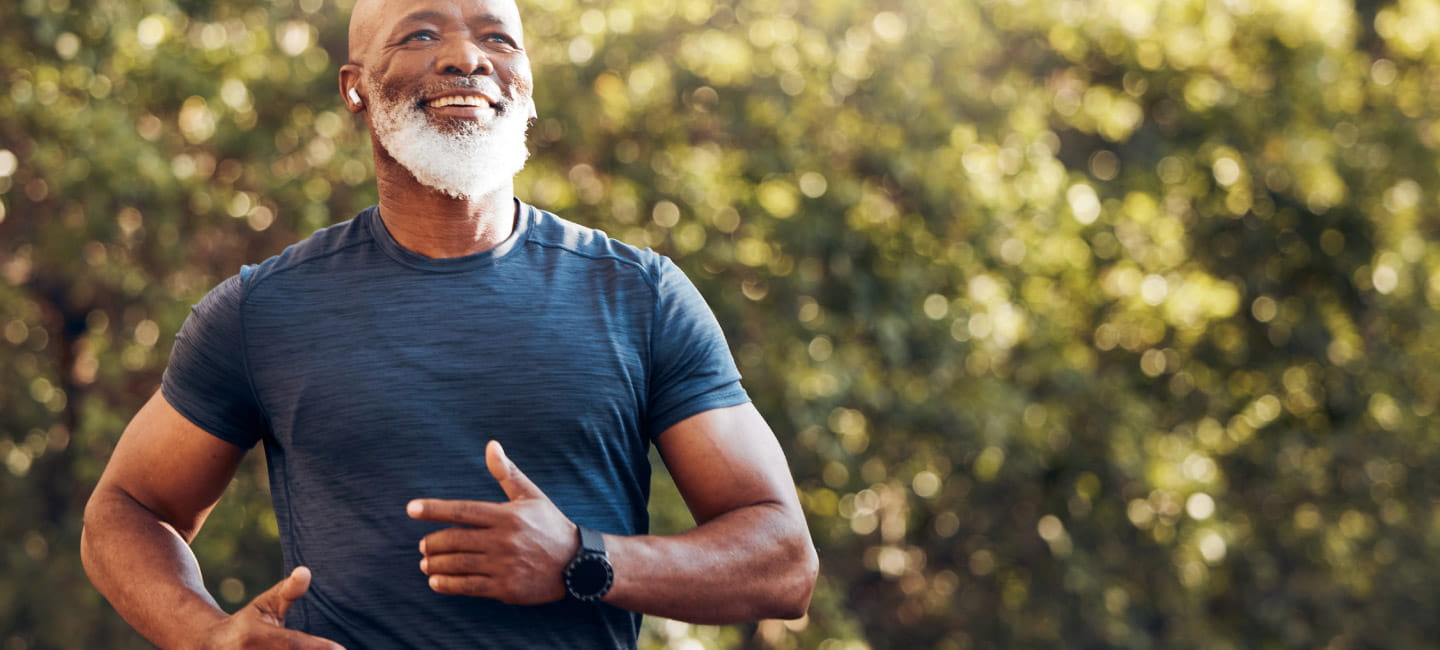 A man running and smiling