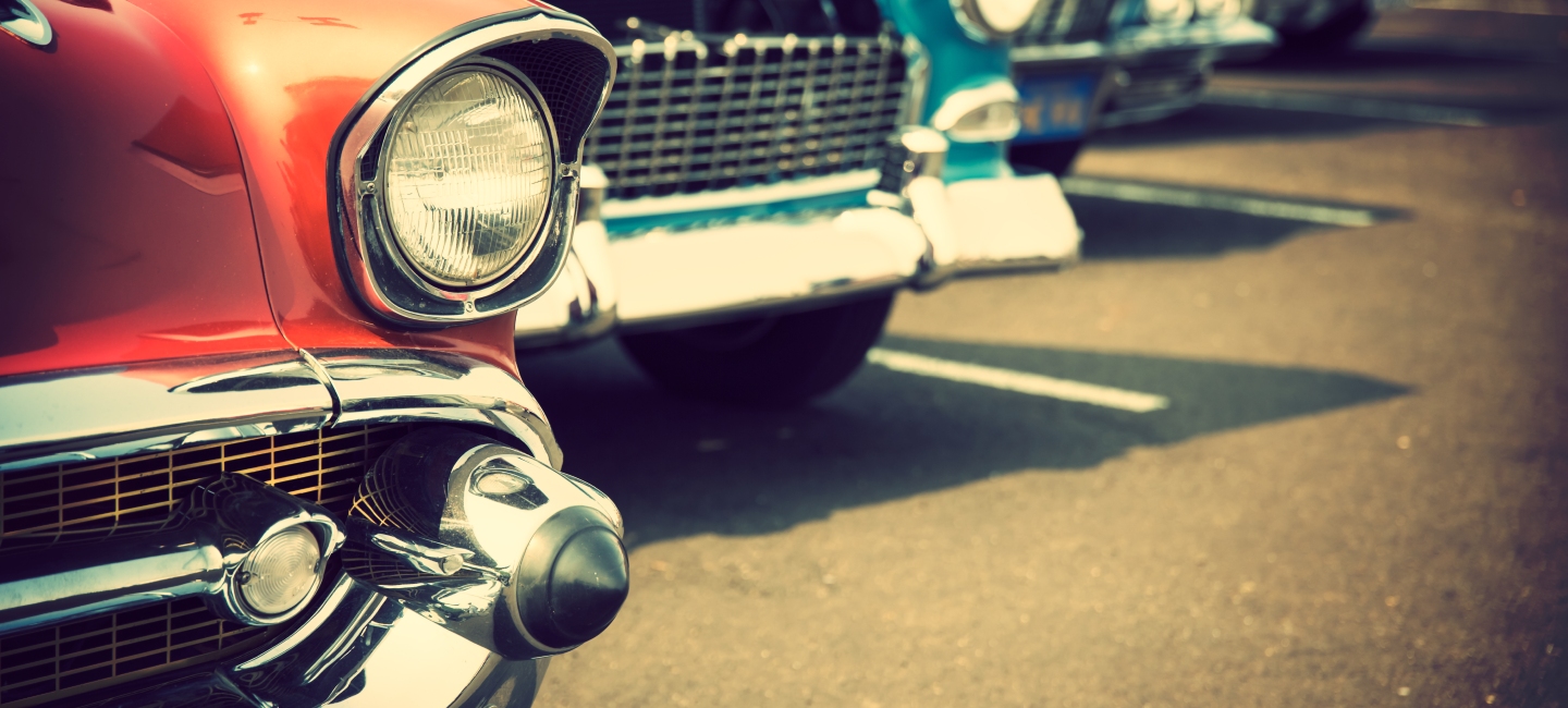 A staggered view of three classic cars