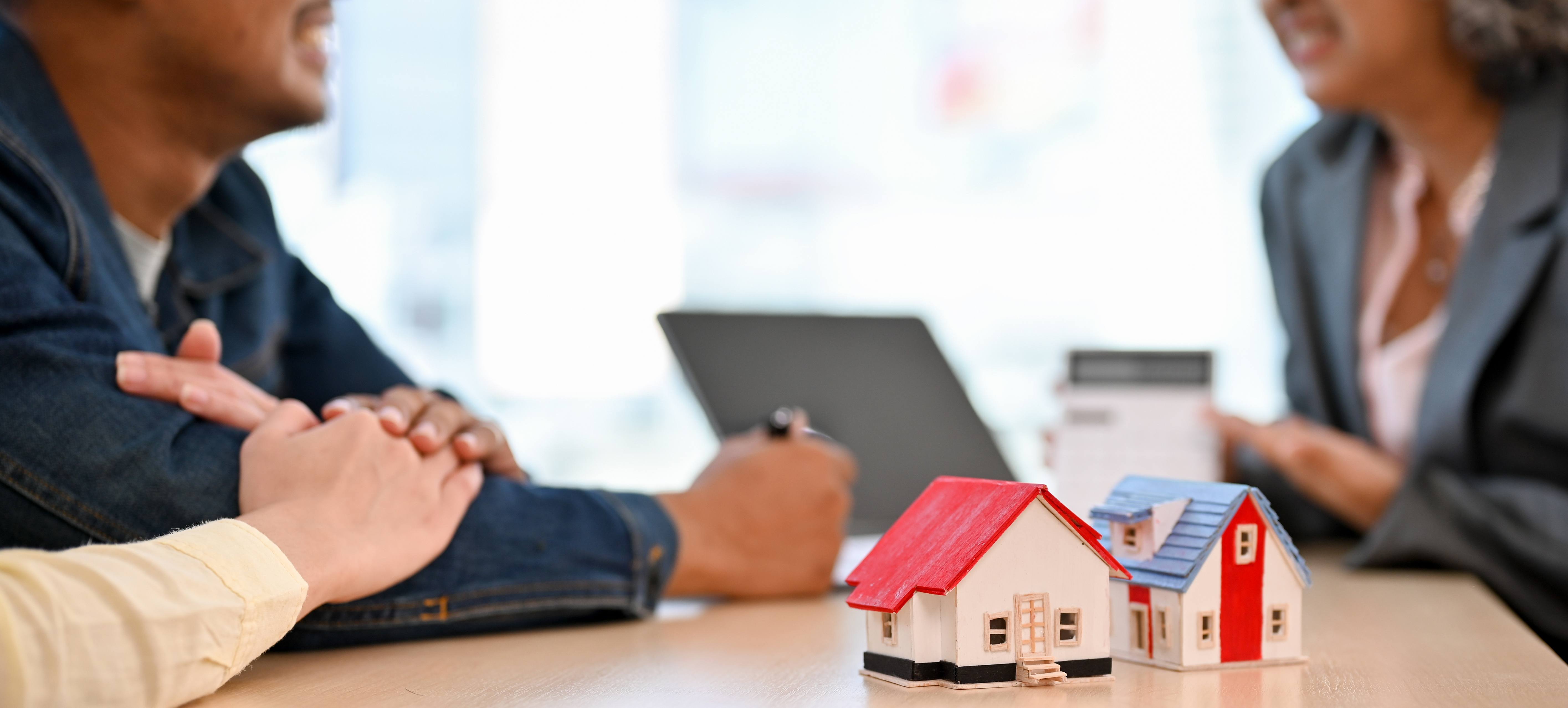A couple talking to a mortgage advisor