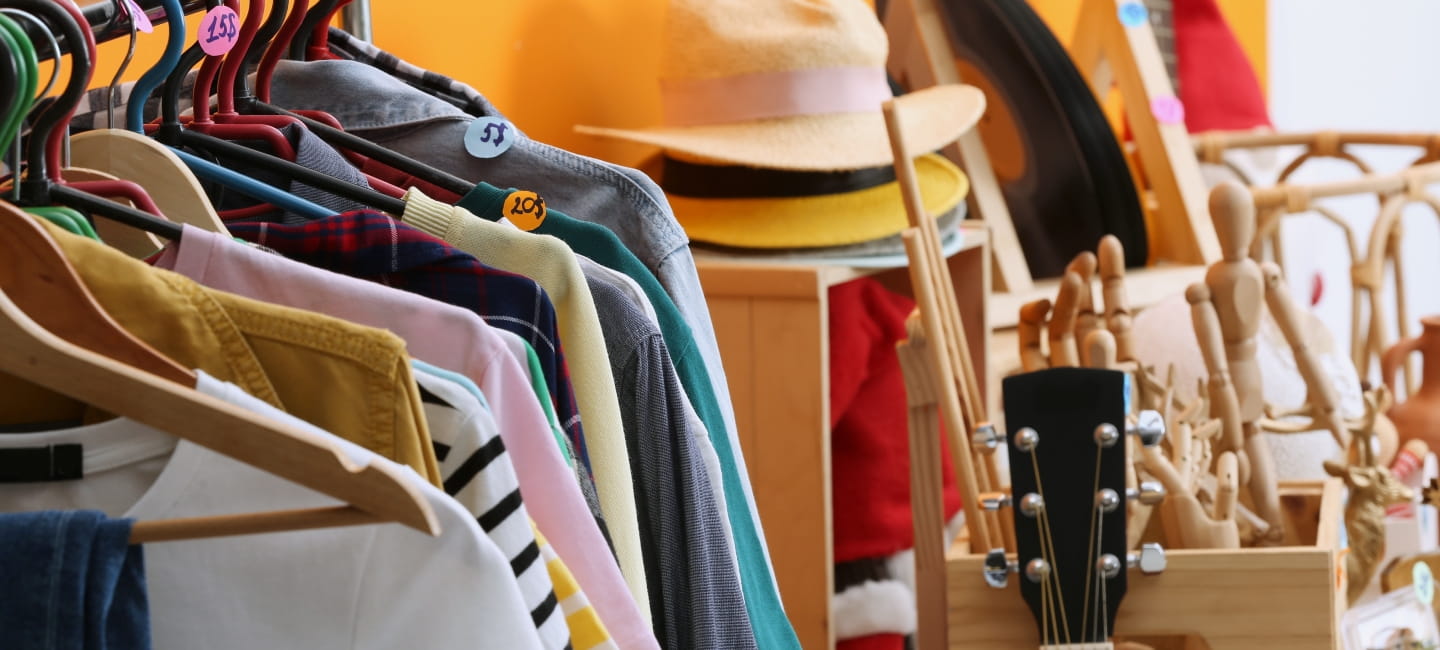 A shop full of clothes and hats 
