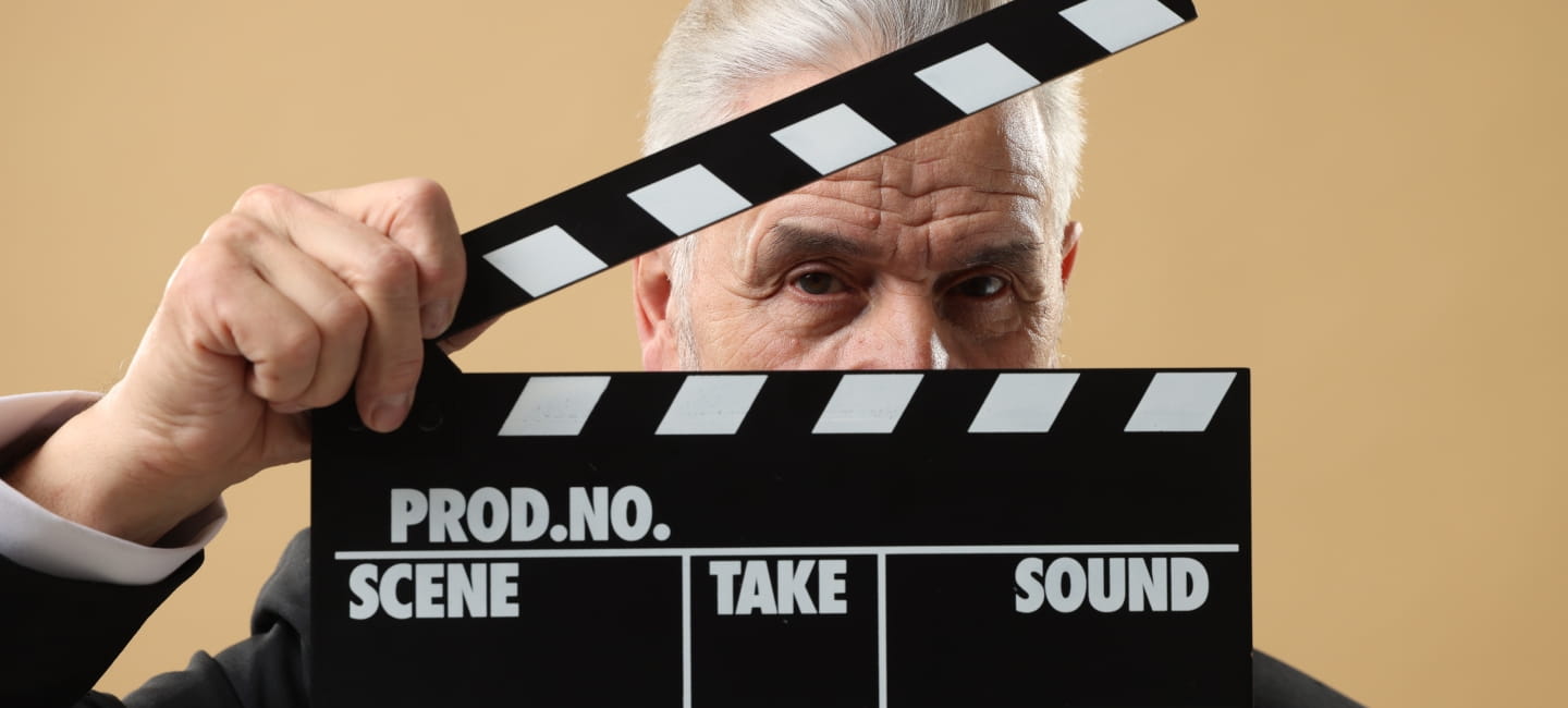 A man holding a clapperboard