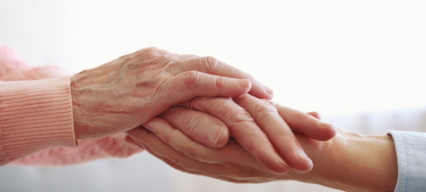 Two people holding hands