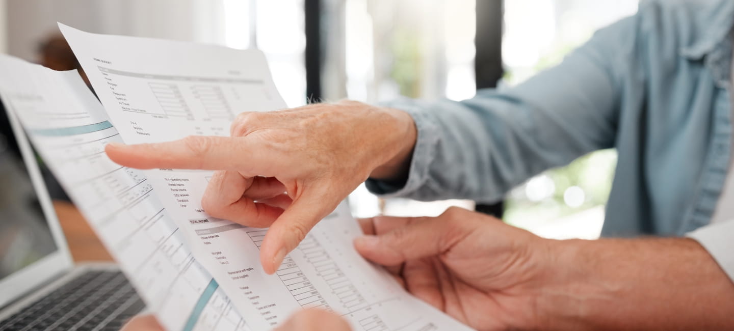Two people looking at some paperwork