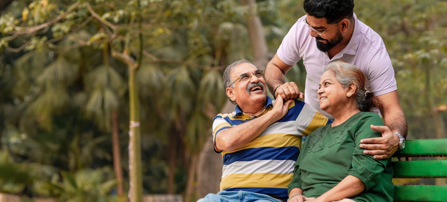 Young Asian man with his parents at park