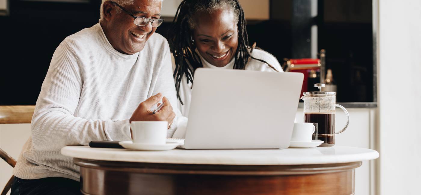 Happy senior couple planning their retirement together.