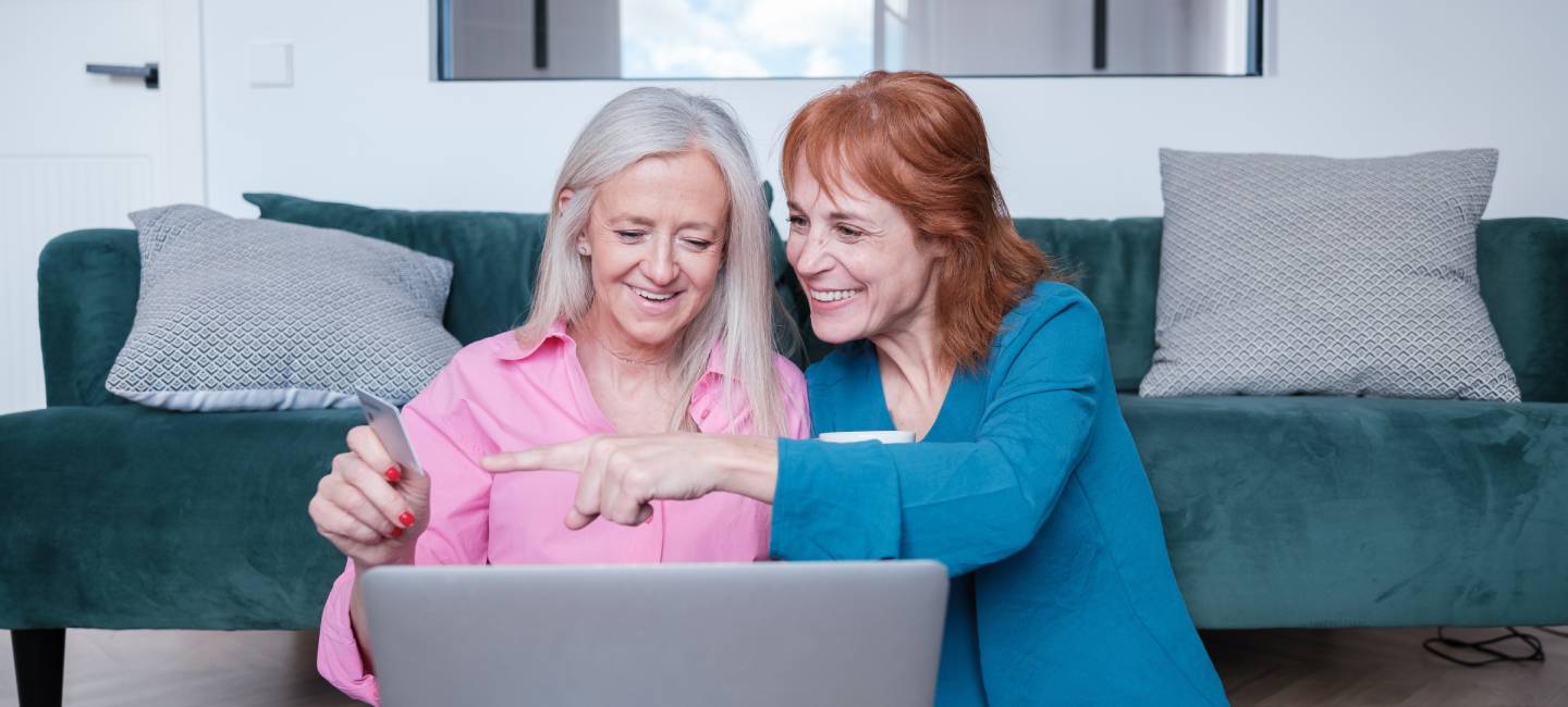 Senior LGTBI couple shopping online together