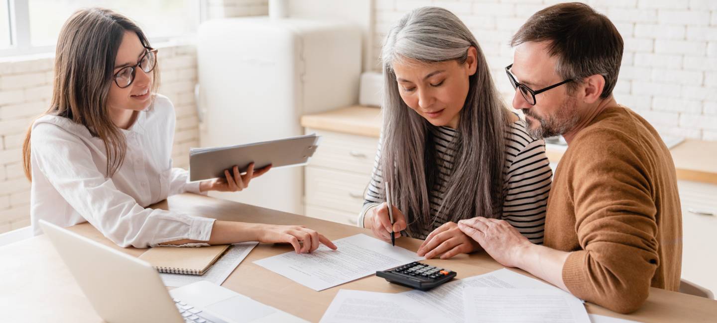 Family couple, discussing mortgages, at home.