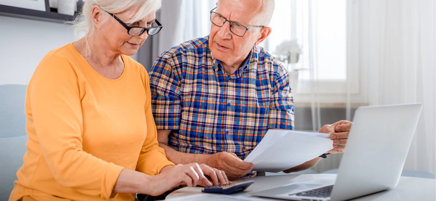 woman and man on the laptop reviewing finances