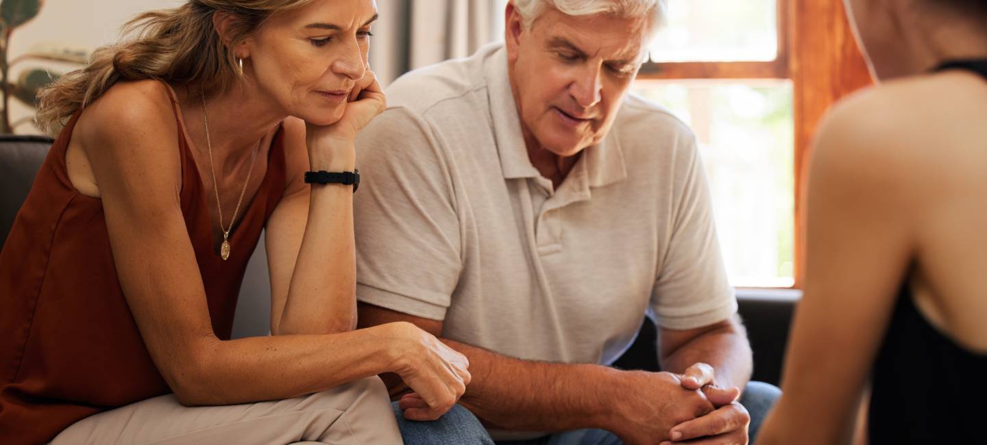 senior couple with lawyer shaking hands with  tax accountant for a successful deal