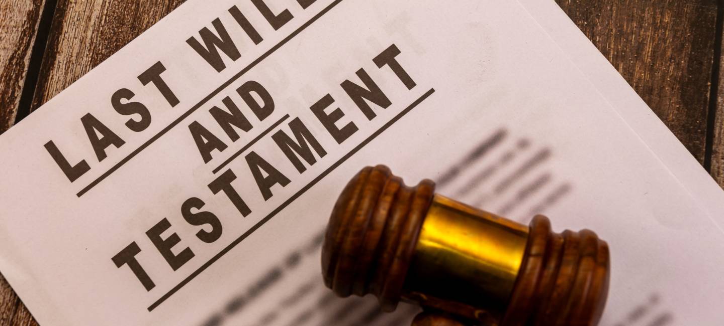Legal document and gavel on wooden background. Estate planning, inheritance, and probate law concept.
