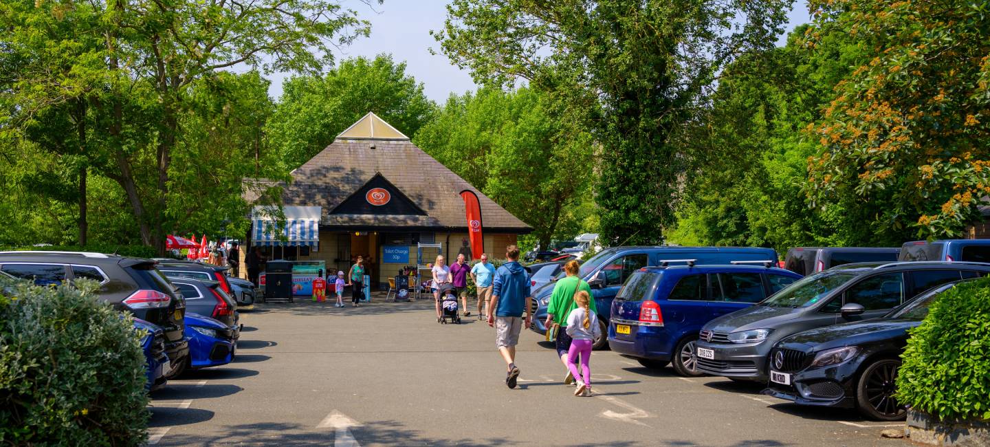 Family walking through a car park