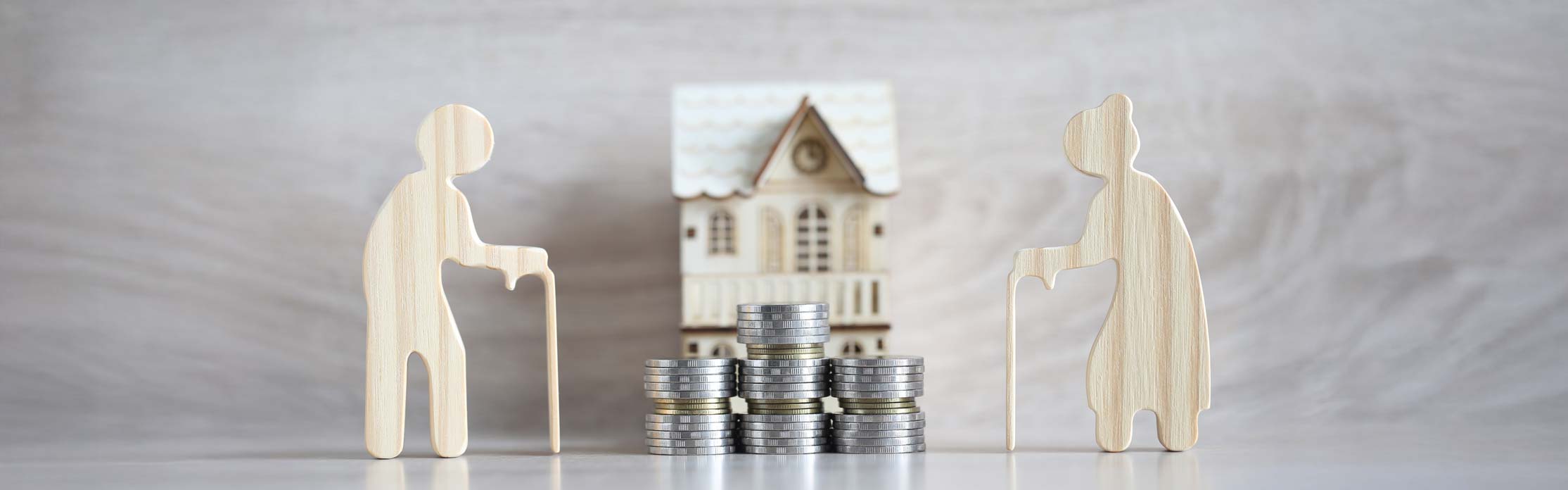 Mutual fund,Love couple senior and model house on wooden background, Save money for prepare in future and pension retirement concept