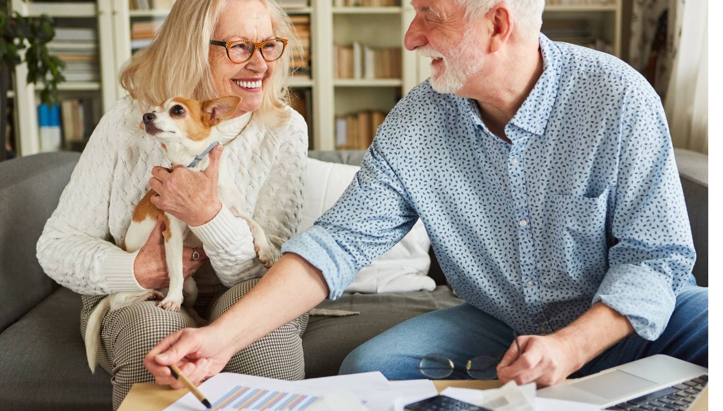 Happy senior couple in bookkeeping talks about retirement provision through annuity and investment