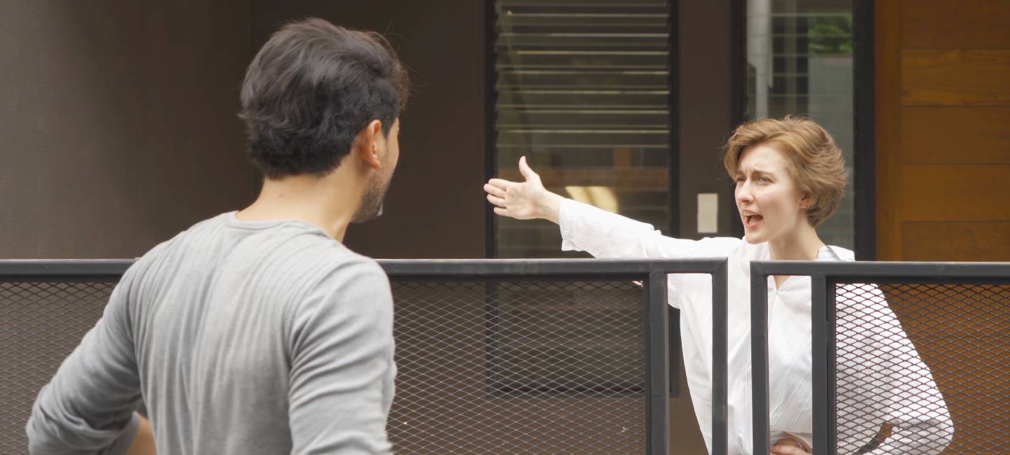 An angry neighbor shouting, blaming, yelling at each other in their homes in village. 