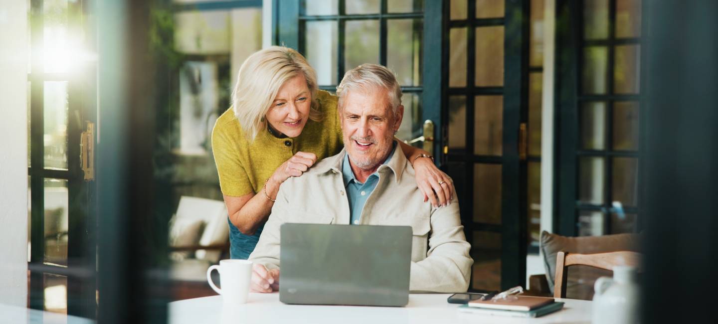 Online banking, savings account bonus and pension review with senior man and woman in house for audit
