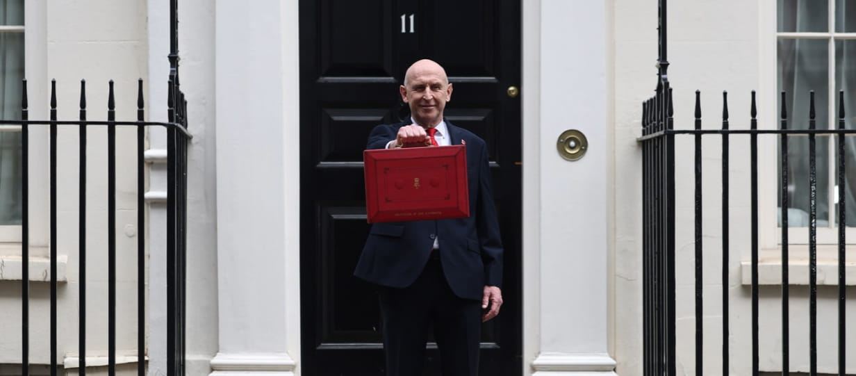 John Healey outside 11 Downing Street with the red case