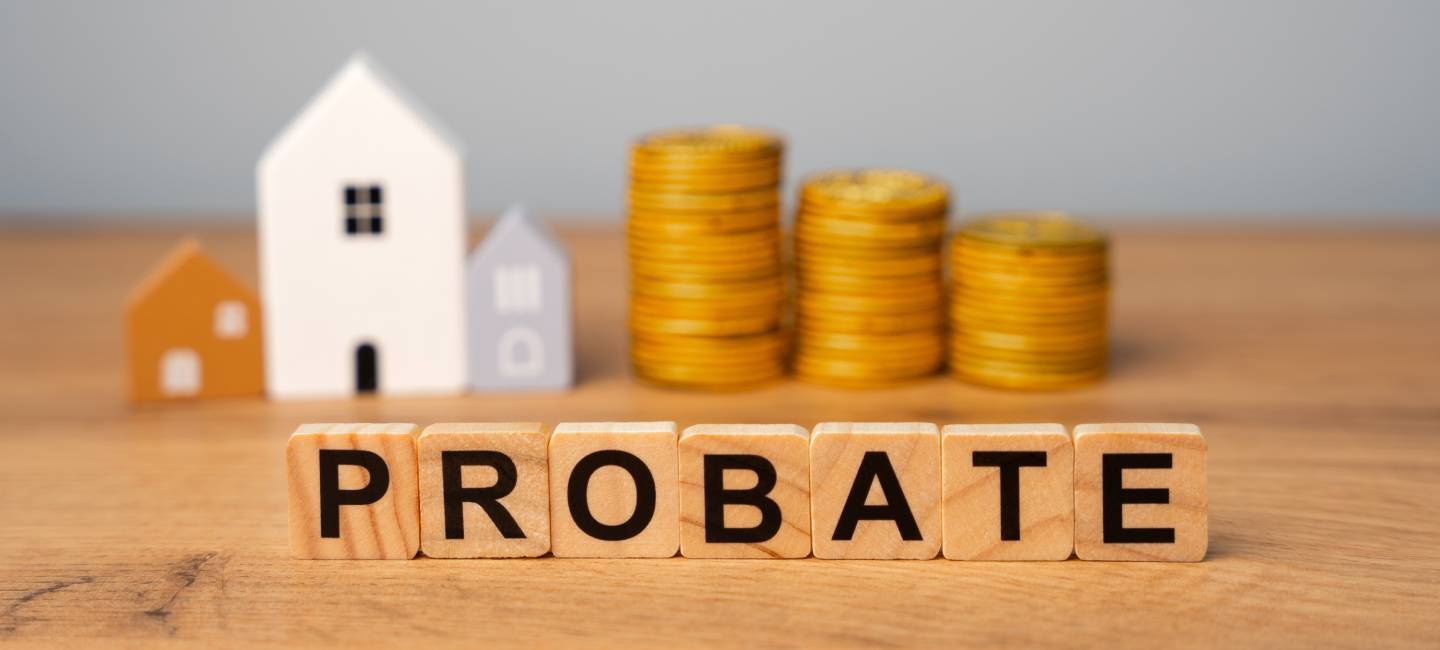 Real estate that is part of a deceased person's estate and managed or distributed through the probate