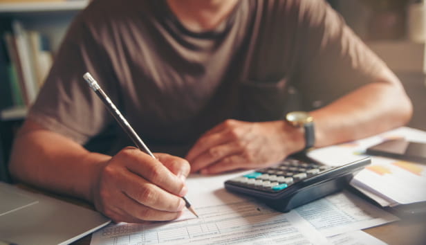 A man completing paperwork