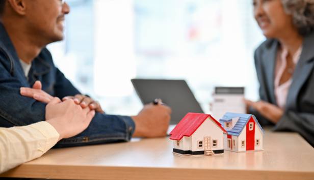 A couple talking to a mortgage advisor 