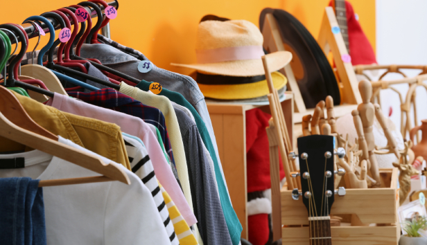 A shop full of clothes and hats 